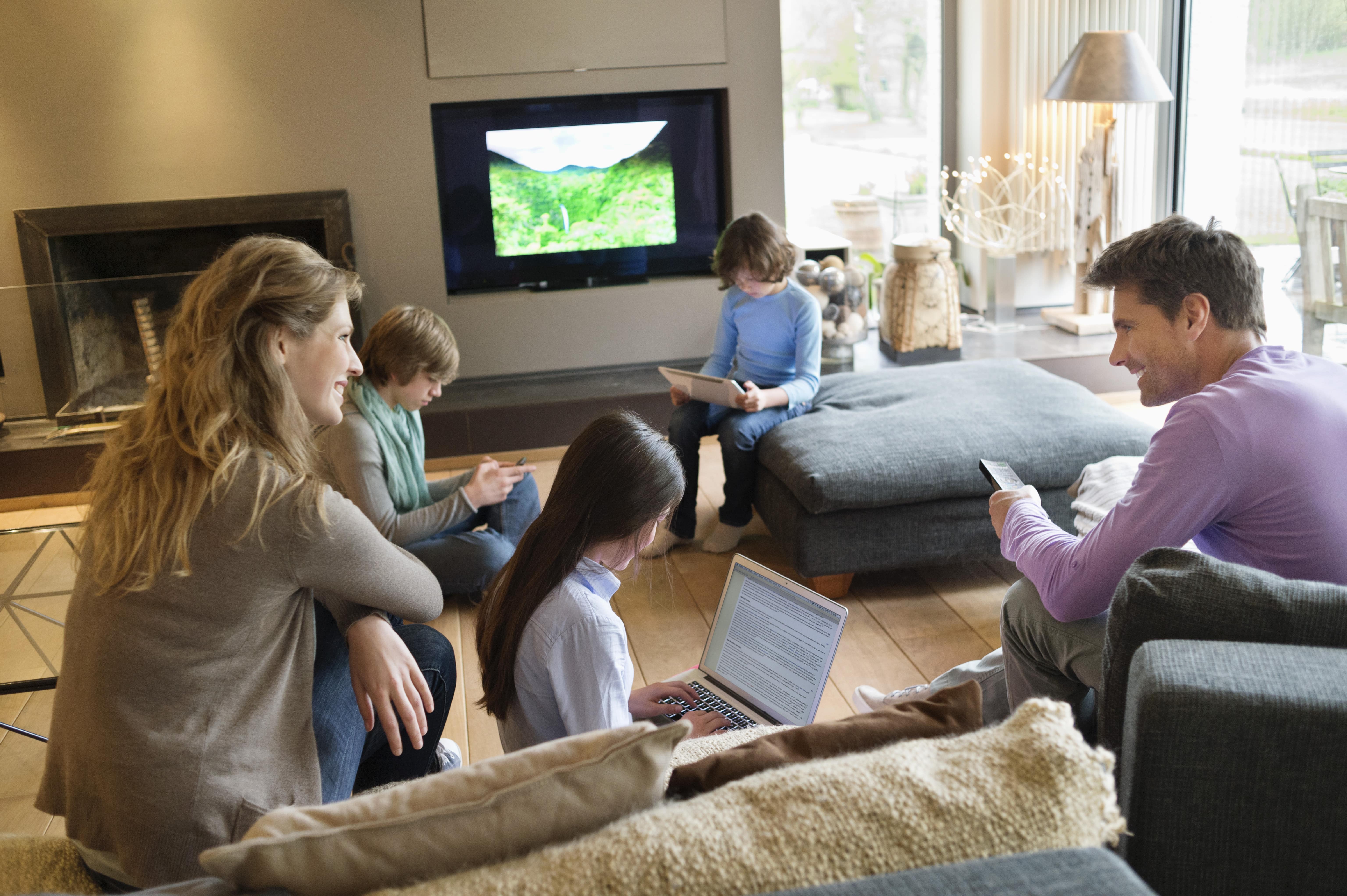 Happy family with children using technology